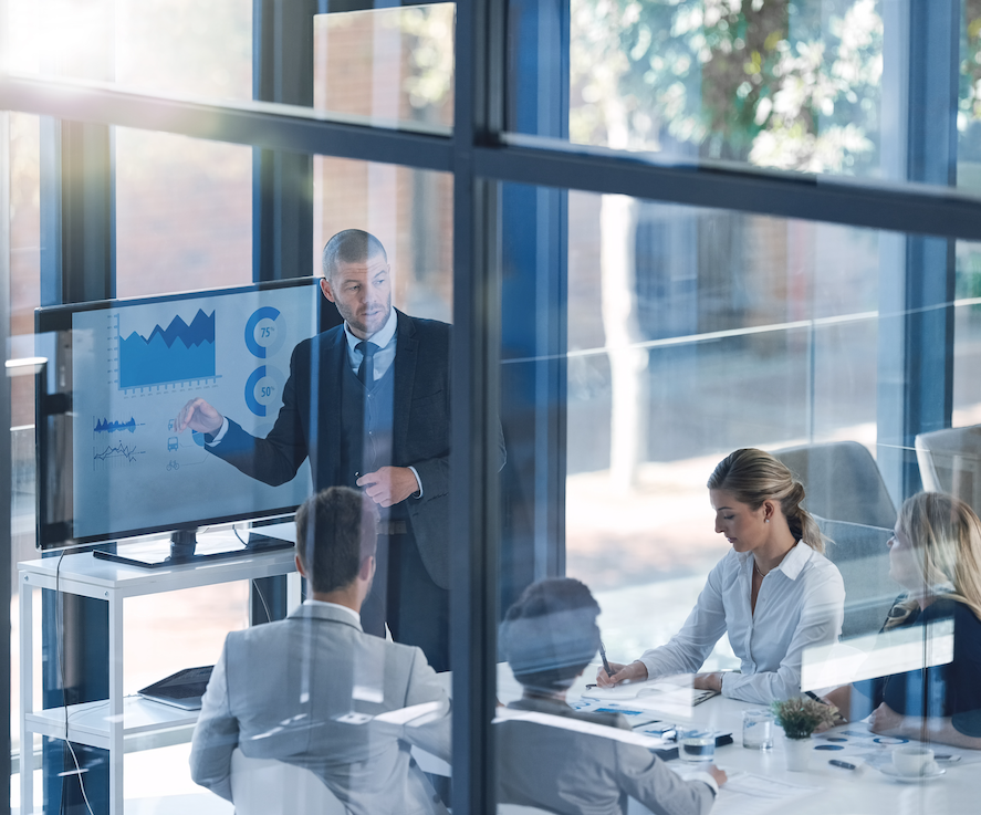 Business meeting finance team in front of analytics report