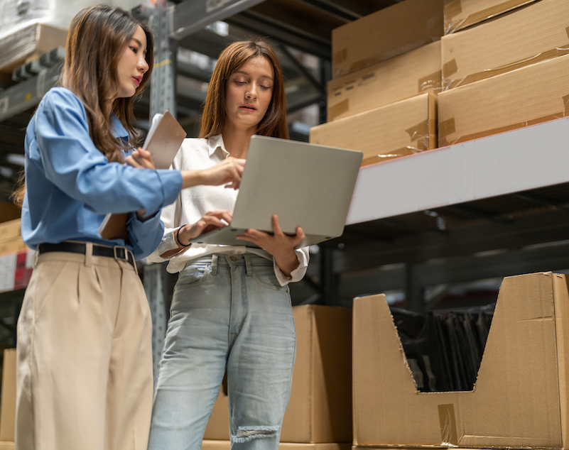 Female warehouse staff teamwork, supply chain logistics management shipping inventory check computer