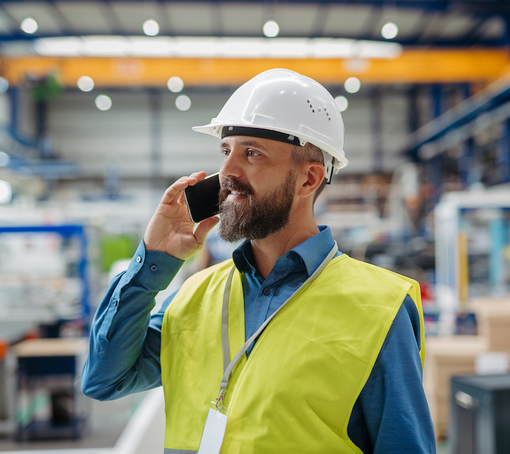 Project manager engineer factory making phone call
